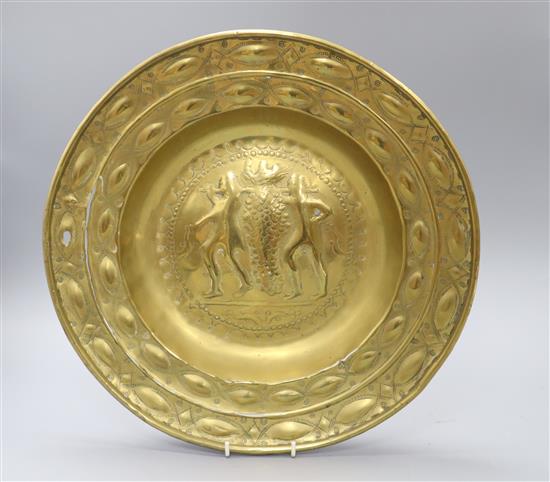A 17th century Nuremberg brass offering dish, marked to the reverse To the use of Lexden Church as a Thank Offering from John Thompson